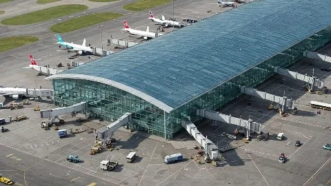 Modern Luton Airport terminal with shops, cafes, free Wi-Fi and passenger amenities